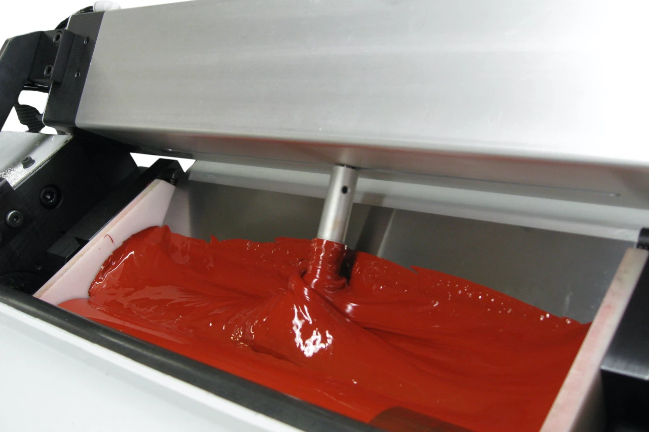 Ein Farbverrührfinger wird im AP Systems Farbverrührsystem pneumatisch angetrieben. Er sorgt dafür, dass die Farbe während dem Druck nicht eintrocknet und stockt. Dies ist besonders für UV-Druck wichtig.